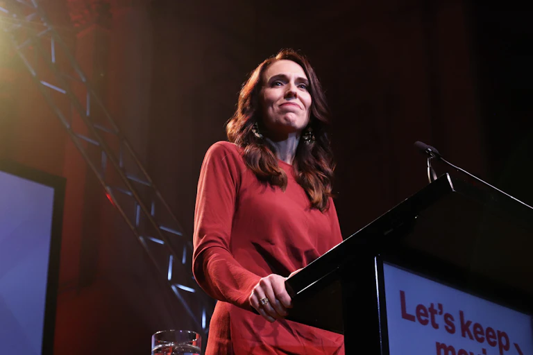 Jacinda Ardern standing at podium