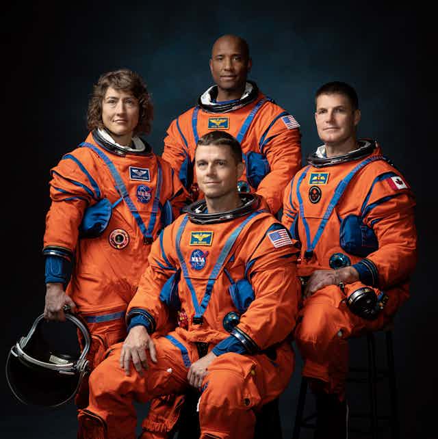 From left to right: Christina Koch, Reid Wiseman (seated), Victor Glover and Jeremy Hansen make up the Artemis II crew.