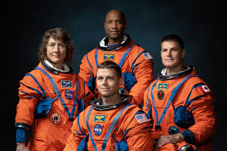 From left to right: Christina Koch, Reid Wiseman (seated), Victor Glover and Jeremy Hansen make up the Artemis II crew.