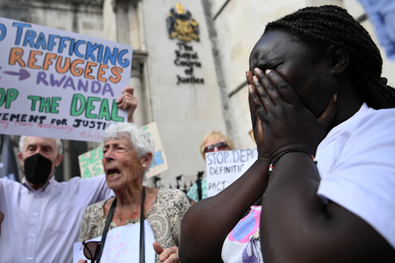 Woman crying during protest outside High Court in London