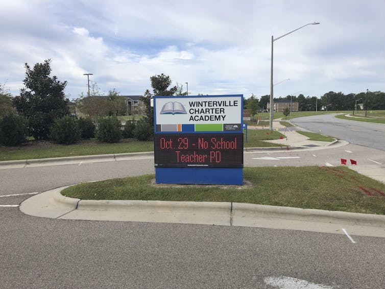 A sign for a charter academy school.