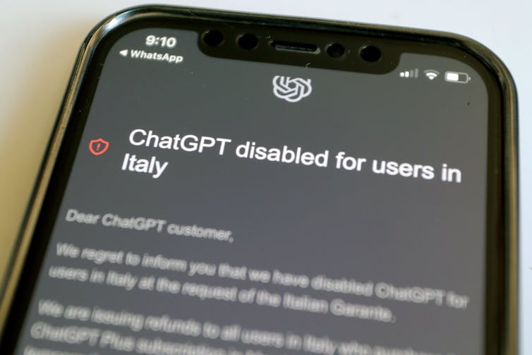 A mobile phone displays a notification explaining that access to ChatGpt has been suspended in Italy