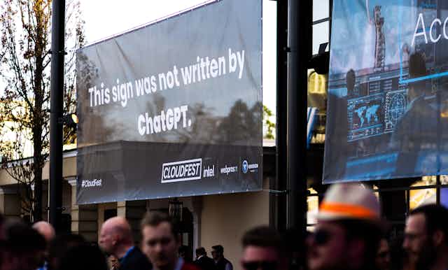  a banner reading "This sign was not written by ChatGPT