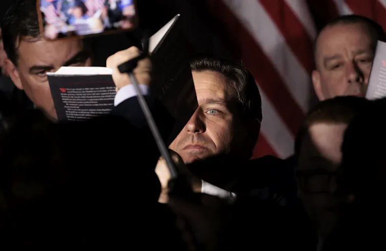 Ron DeSantis signs copies of his book at an event at the Cradle of Aviation Museum in New York, April 1 2023.