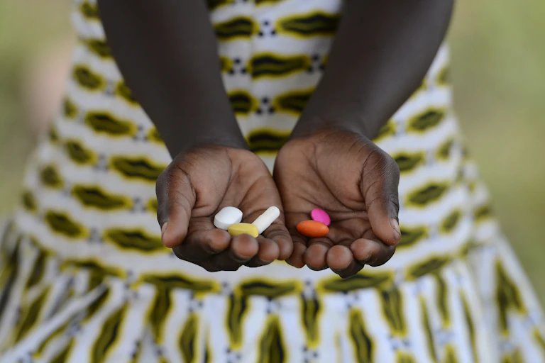 a little girls holding tablets in her hands