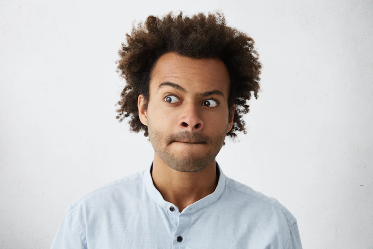 Dark-skinned male model being worried about something