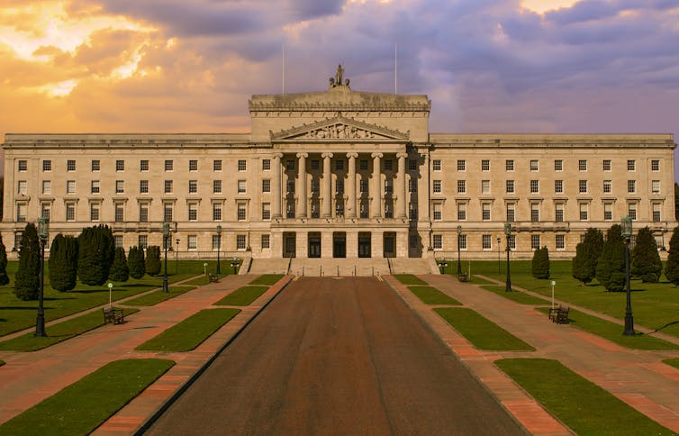 Landscape photo of a white building with neoclassical columns