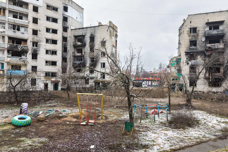 An empty children's playground in a bombed city in Ukraine.