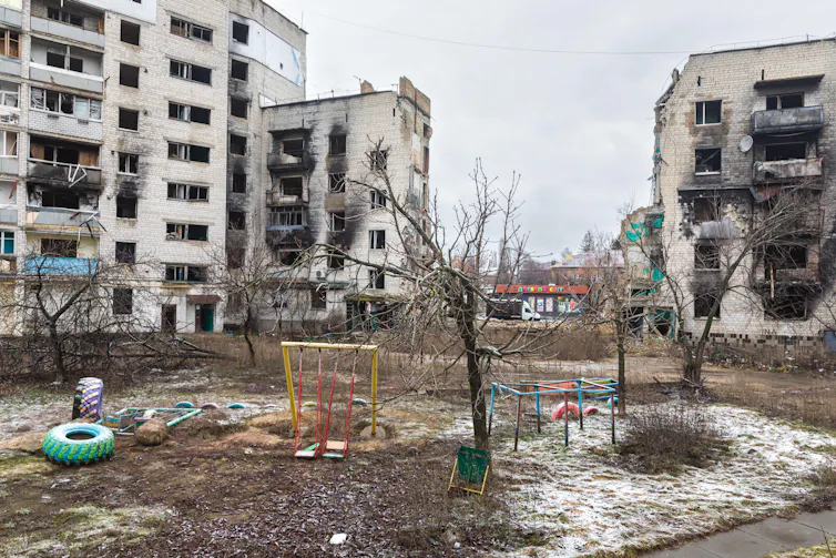 An empty children's playground in a bombed city in Ukraine.