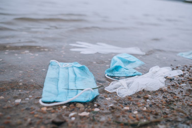 Face masks and gloves in water