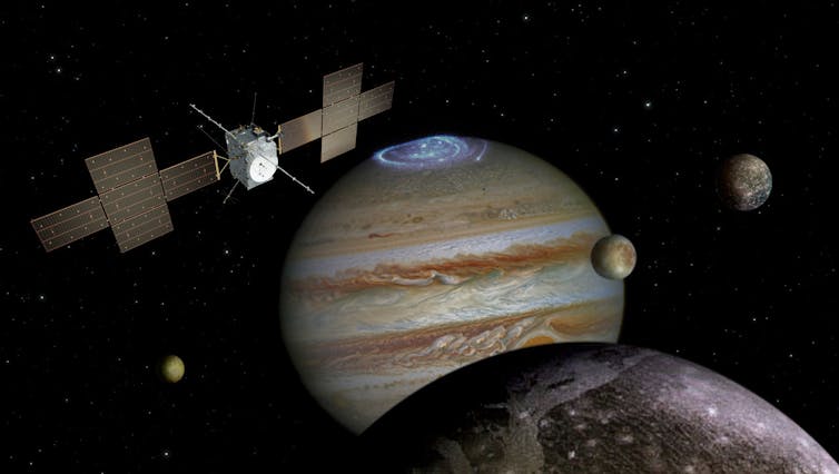 Artist's impression of the JUICE spacecraft approaching Jupiter and the jovian moons.