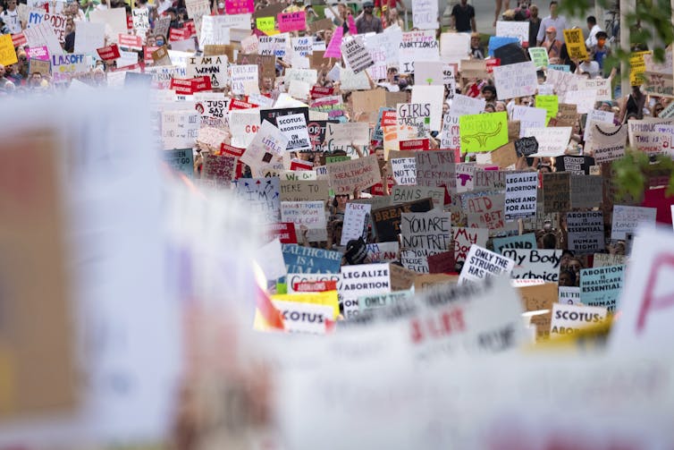 A sea of people carrying pro-choice signs.