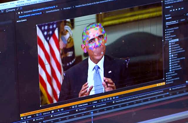 a screen showing a video player with an image of former president barack obama. layered on top of his face are multicoloured pixels