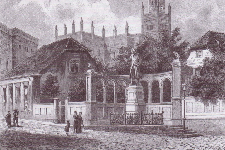 Dibujo de la estatua de Kant en una ciudad.