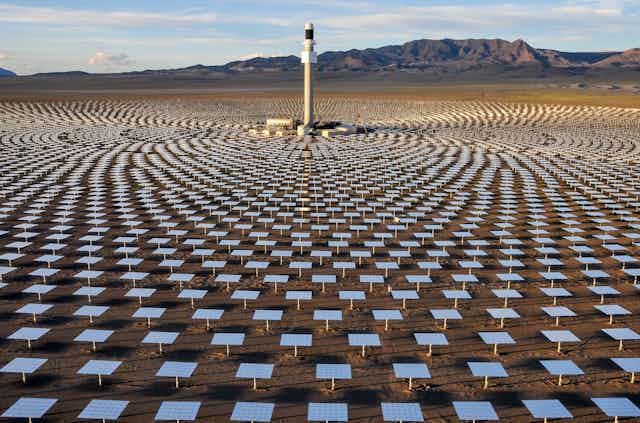 A field of mirrors concentrates light and heat on a central tower at the Crescent Dunes Solar Energy Project near Tonopah, northwest of Las Vegas.