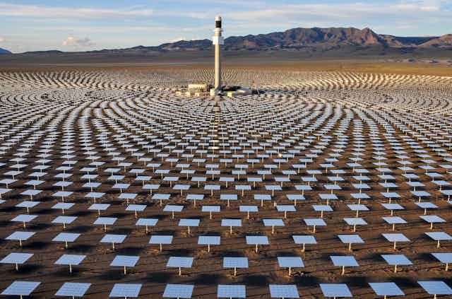 A field of mirrors concentrates light and heat on a central tower at the Crescent Dunes Solar Energy Project near Tonopah, northwest of Las Vegas. 