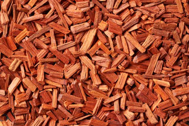 a pile of reddish wood chips