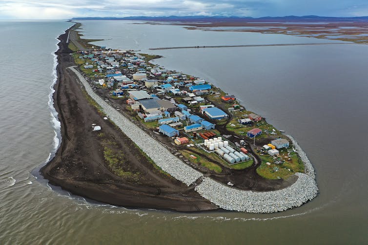 An aerial view of Kivalina shows the boulders surrounding parts of the narrow island.