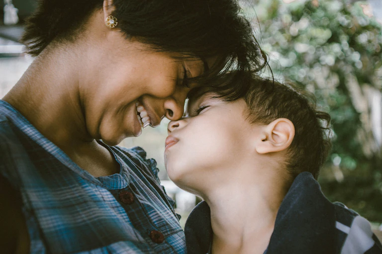 parent and child touch noses