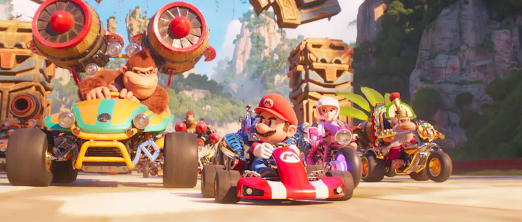 Still of animated characters racing in carts.