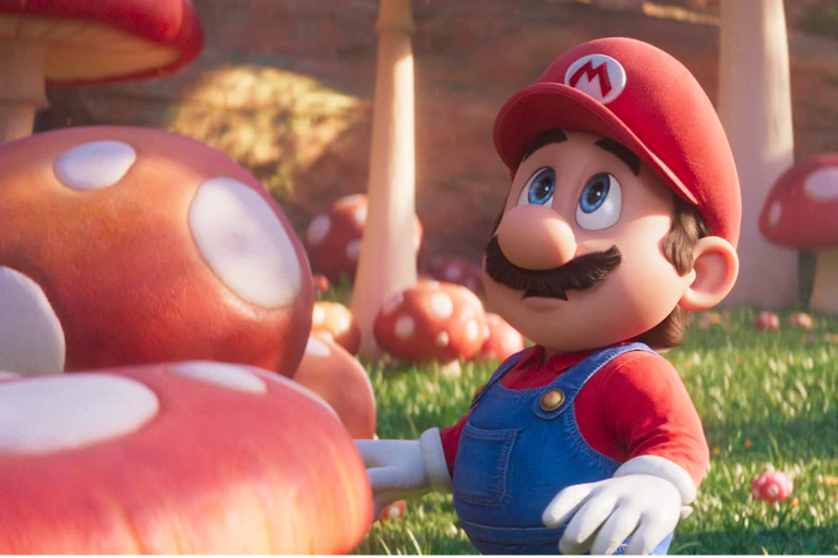 An animated character surrounded by giant mushrooms.