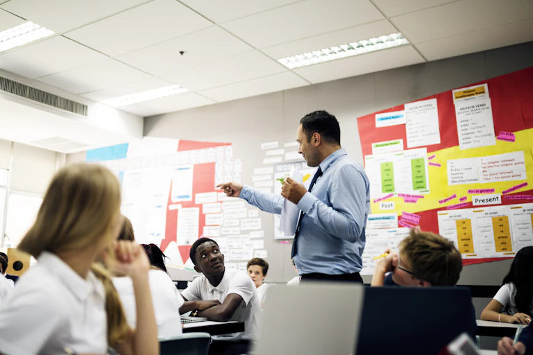 Teacher in classroom talking to students