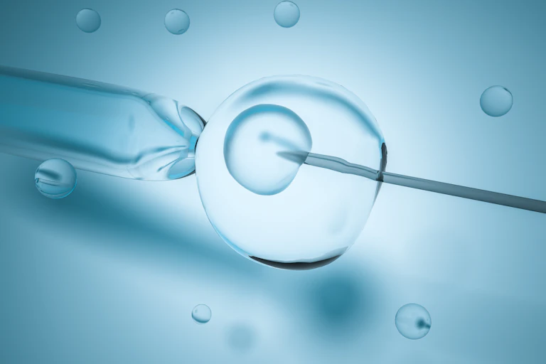 a needle is injected into a cell on a blue background