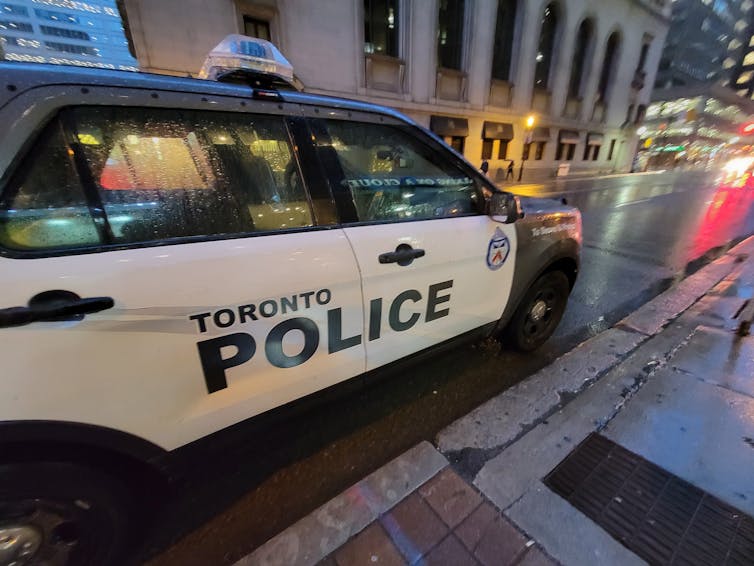 A Toronto police cruiser parked on a roadside