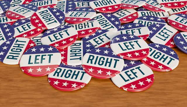 A pile of red, white and blue campaign buttons that say either 'RIGHT' or 'LEFT.'