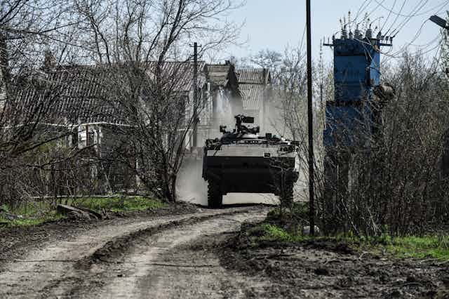 A Ukrainian forces' M113 APC  driving through the countryside near Bakhmut in eastern Ukraine