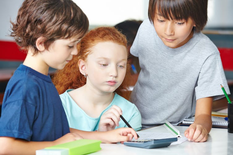 Three children working together