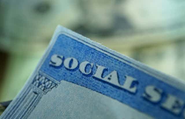 A closeup of the corner of a social security card