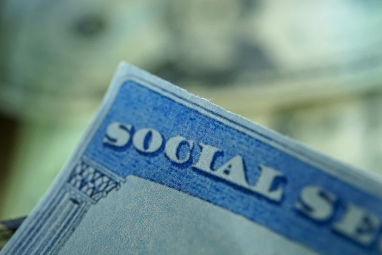 A closeup of the corner of a social security card