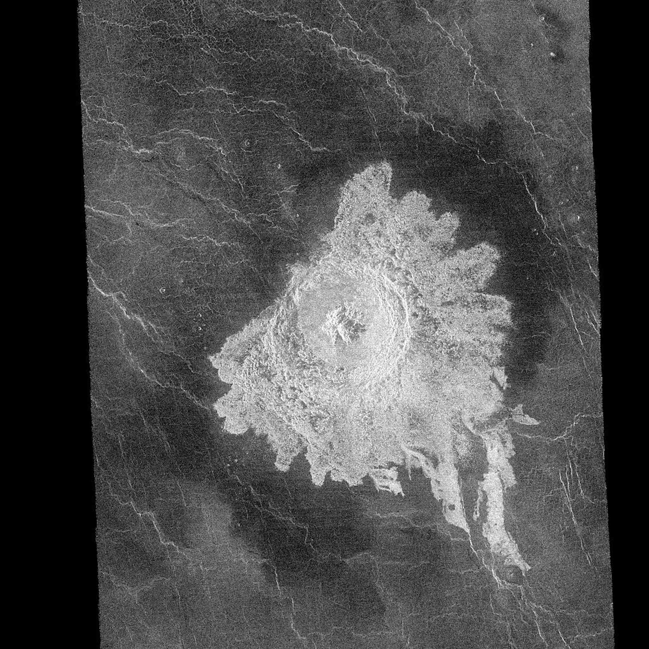 A greyscale image with a bright white semicircular shape standing out against a dark background
