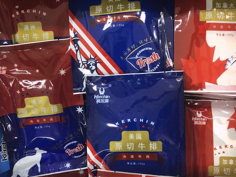 Frozen packages of beef filets with the flags of Australia, the U.S. and Canada.