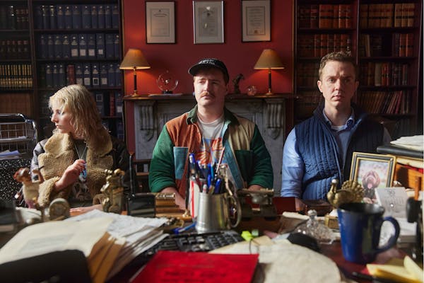 Thomasin McKenzie, Brandon McClelland and Rowan Witt sitting in a lawyer's office