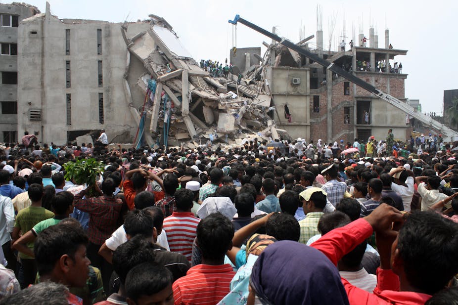 Hundreds of people outside the collapsed Rana Plaza building