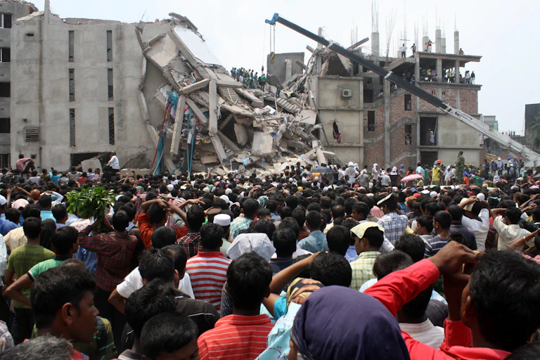 Hundreds of people outside the collapsed Rana Plaza building