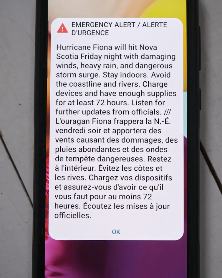 Emergency alert message sent to residents of Nova Scotia, Canada, warning of Hurricane Fiona. Residents are instructed to stay inside and avoid all coastal areas.