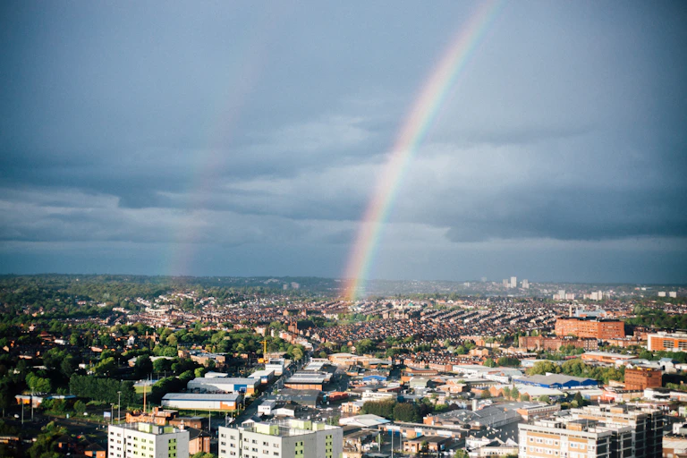 Aerial shot of Leeds with rainbow in the sky.