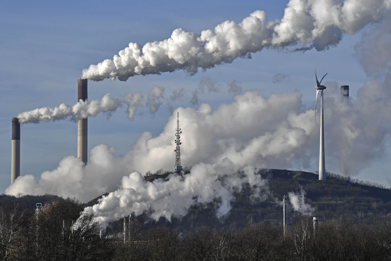 Smoke billowing from factory chimneys