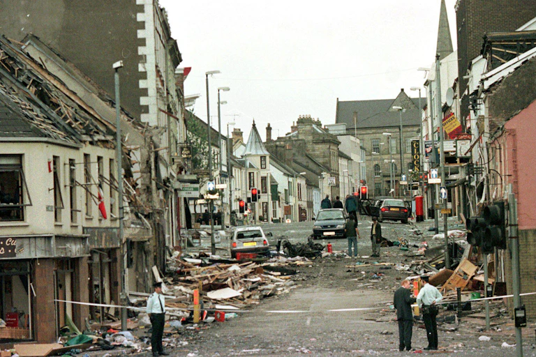 Policemen standing guarding a bombed street in Omagh, Northern Ireland I