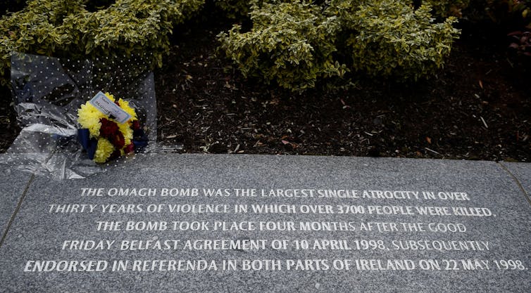 A granite stone plaque commemorating the dead of the Northern Ireland Troubles.