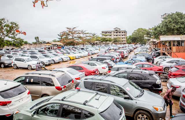 A lot full of used cars in Benin.