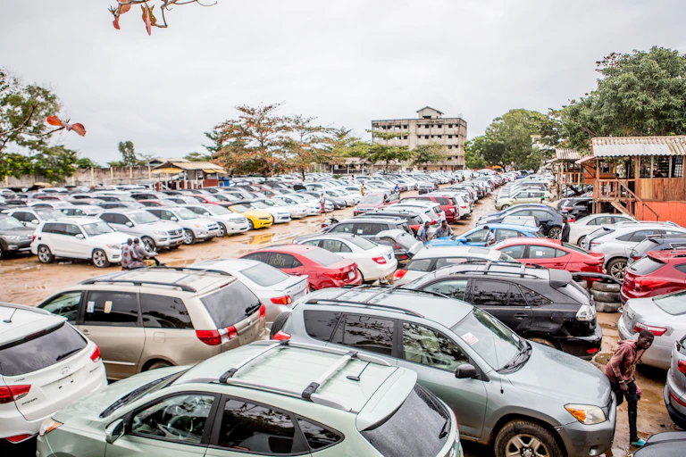 A lot full of used cars in Benin.