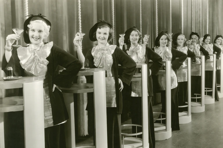 Line of women holding martinis