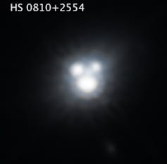Three close-together brightly glowing roundish objects.
