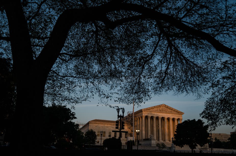 The U.S. Supreme Court building at dusk.