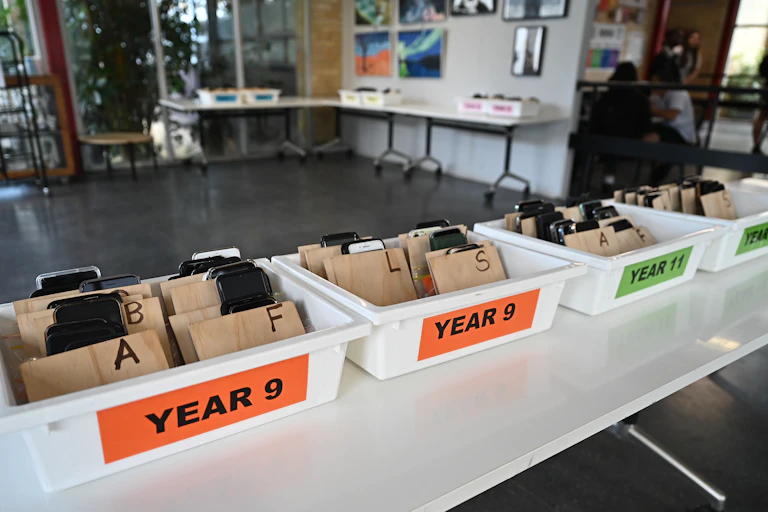 Boxes containing students mobile phones.