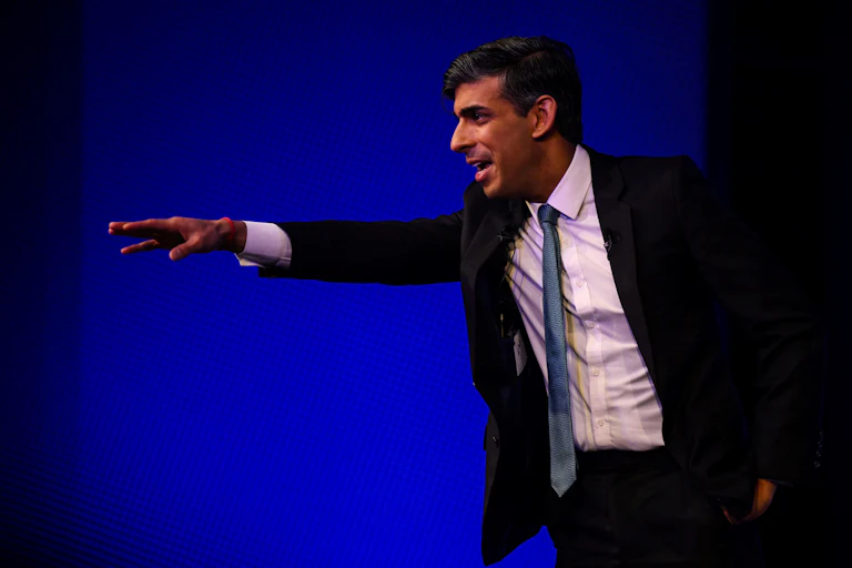 Rishi Sunak reaching out his arm